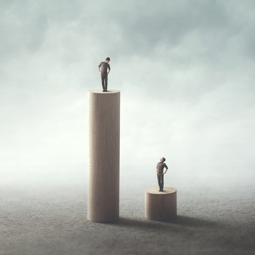 People on stands of different height