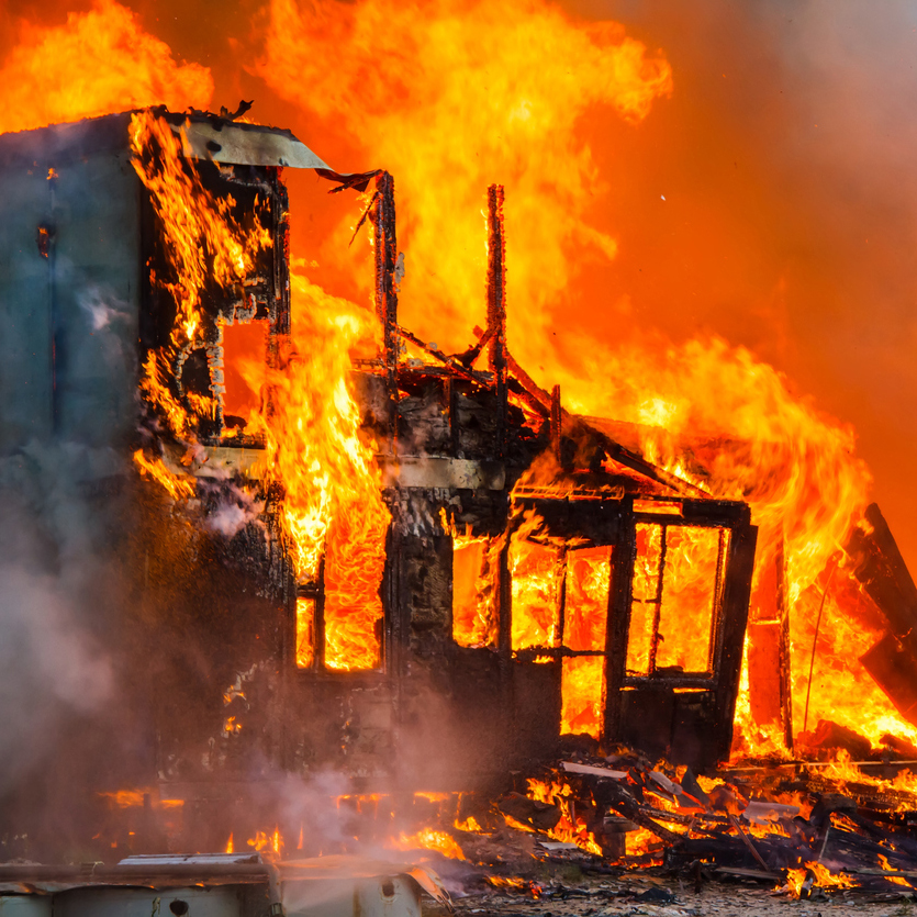 Building structure covered in flames