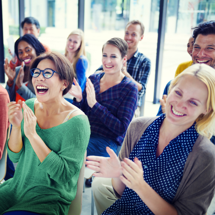 People in the audience applauding