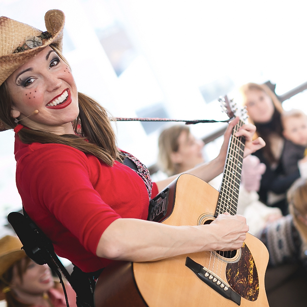 Miss Jamie playing the guitar