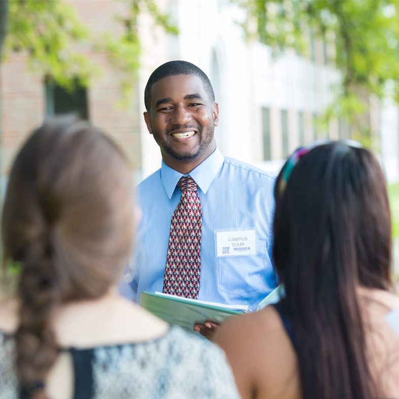 Advisor leading a campus visit