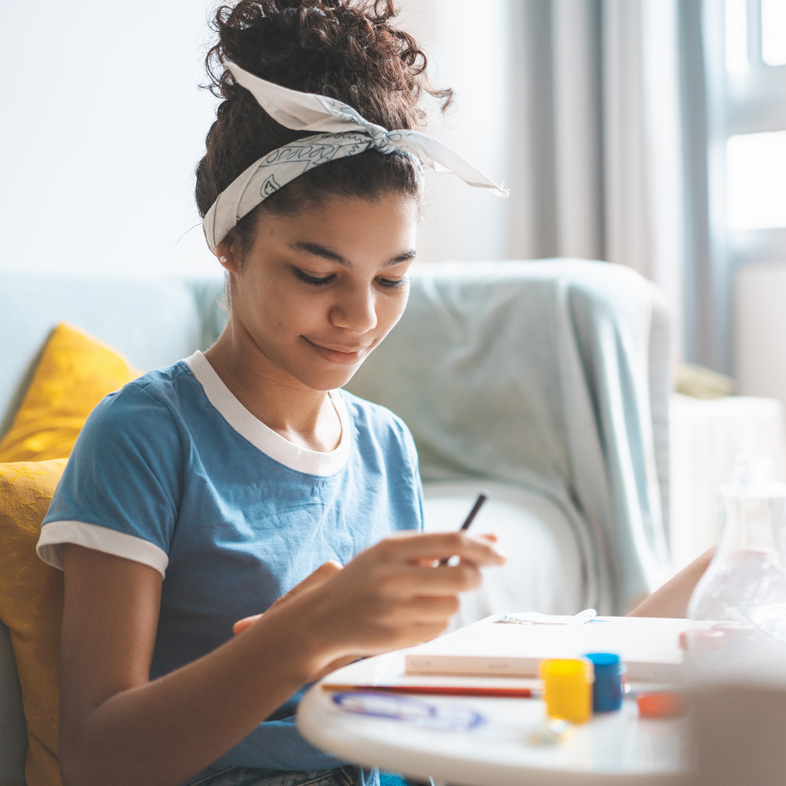 Teen with colored pencils