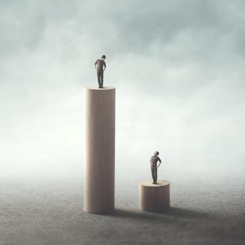 People on stands of different height