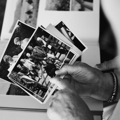 Hand holding old photographs