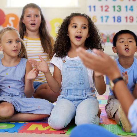 Children singing and clapping