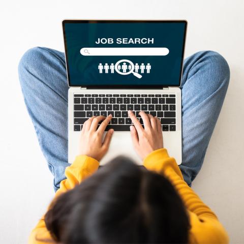 Woman sitting on computer