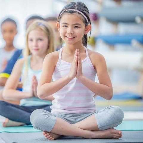 Child in yoga class
