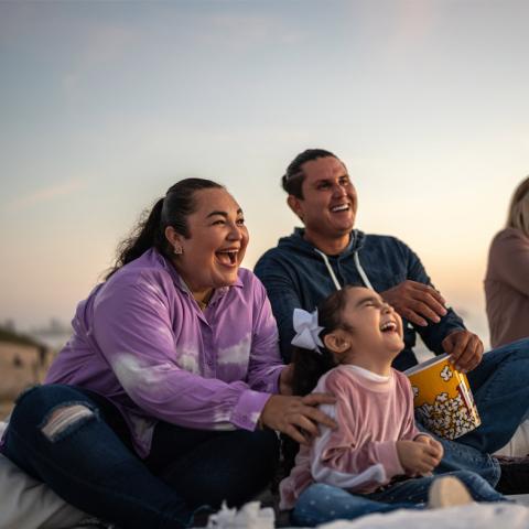 Family watching outdoor performance
