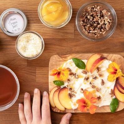 Cutting board with flavored butter, jars of flavored salts