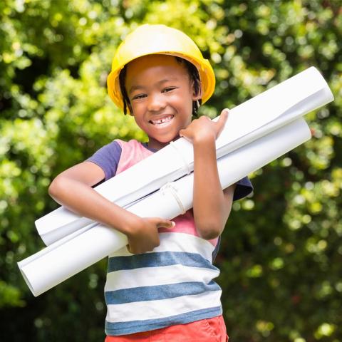 Child wearing hard hat