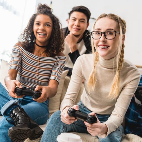 Teens playing videogame