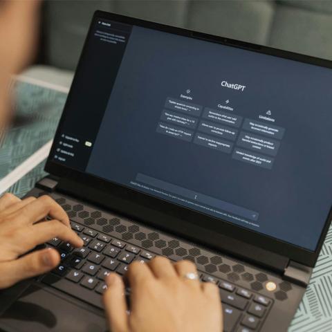 Person using chatGPT on laptop