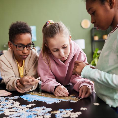 Children putting a puzzle together