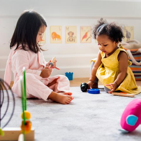 Two babies playing together