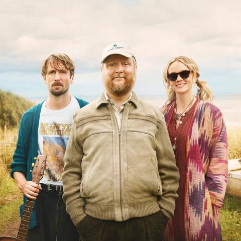 3 actors standing, looking forward