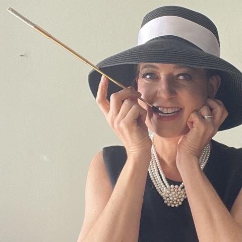 Historian Leslie Goddard portraying actress Audrey Hepburn