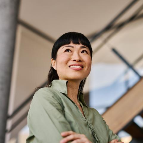Business woman looking up smiling