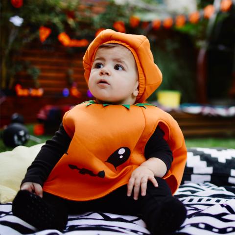Baby in jack-o-lantern costume