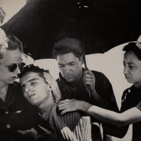 historic photo of nurses caring for patient during WWII
