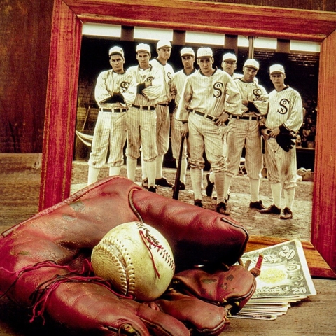 Baseball glove and ball, money, and framed photo of team