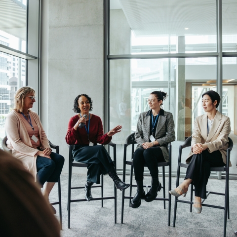 Panel of people looking at someone speaking