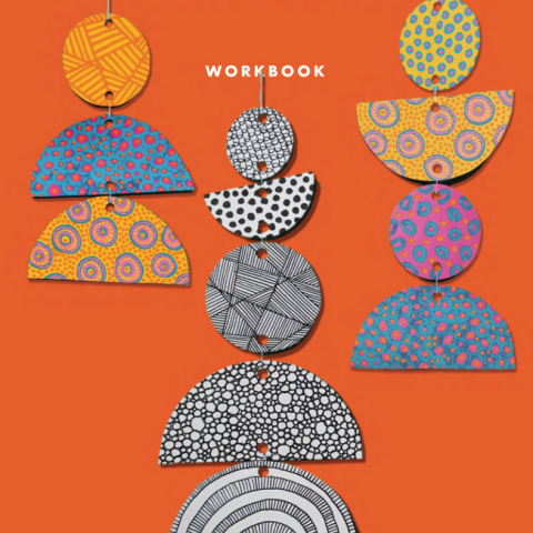 patterns drawn on circles and semi-circles, strung to make mobile