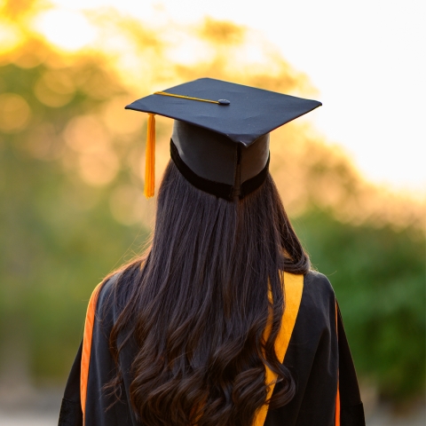 Back of graduate wearing cap and gown