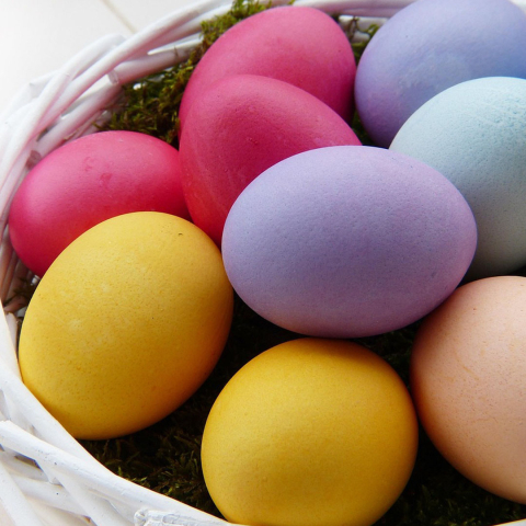 Colorful eggs in a basket