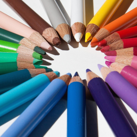 Colored pencils with sharpened points in circle