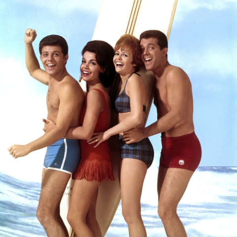 Actors in musical comedy wearing swimsuits