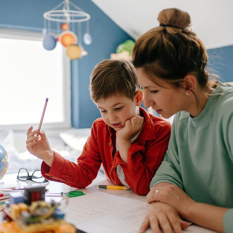 Mother and child working on homework together