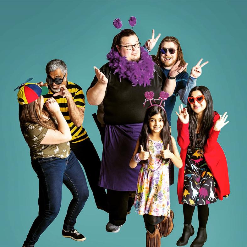 Band members from The Kid-Ups against a blue background