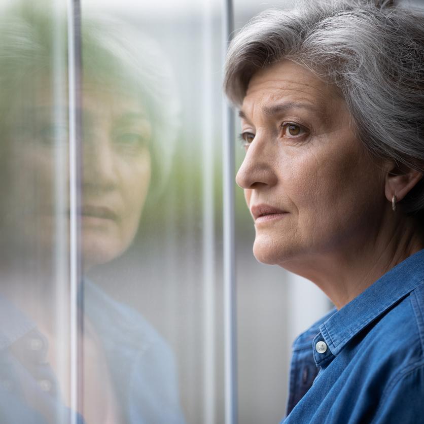 woman looking out window