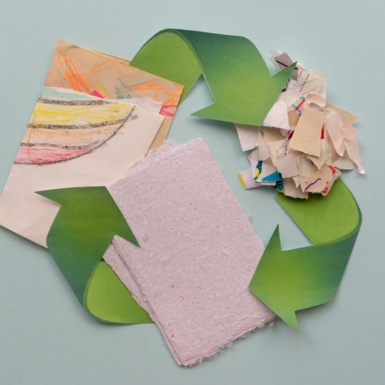 Recycle symbol with paper at each point