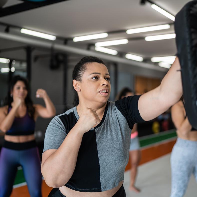 Woman punching a punching bag