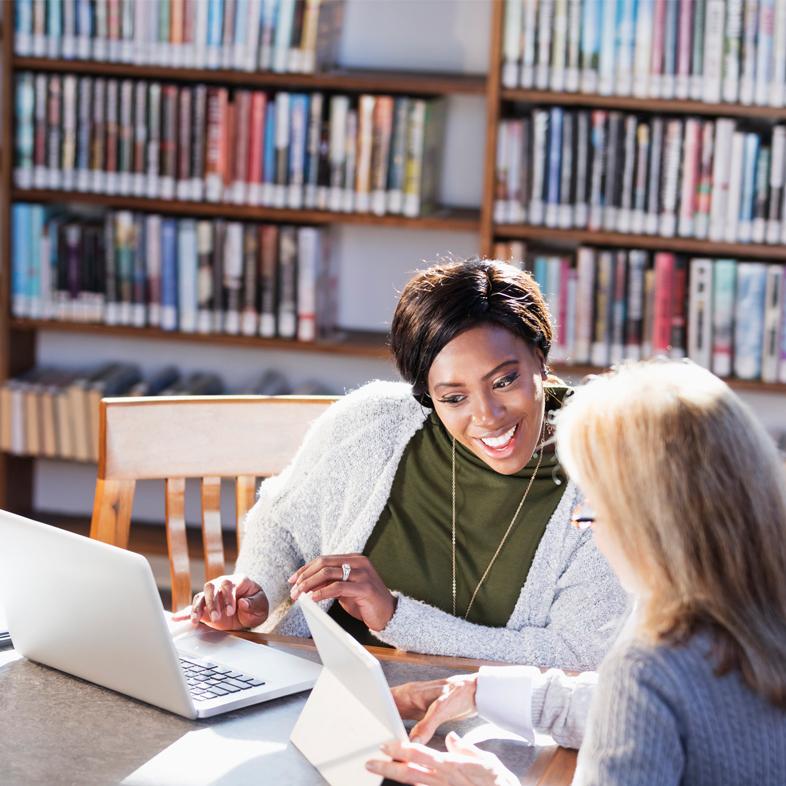women in library working together