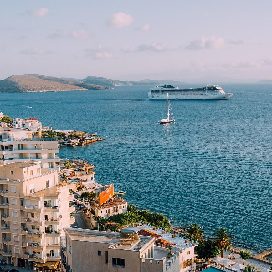 Cruise ship with city in foreground