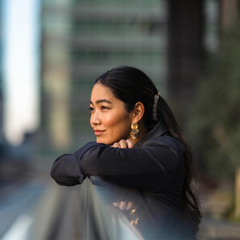 Woman looking out at city