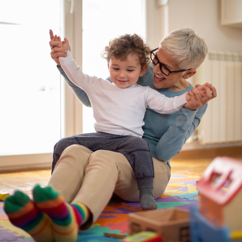 Grandmother dancing with grandson