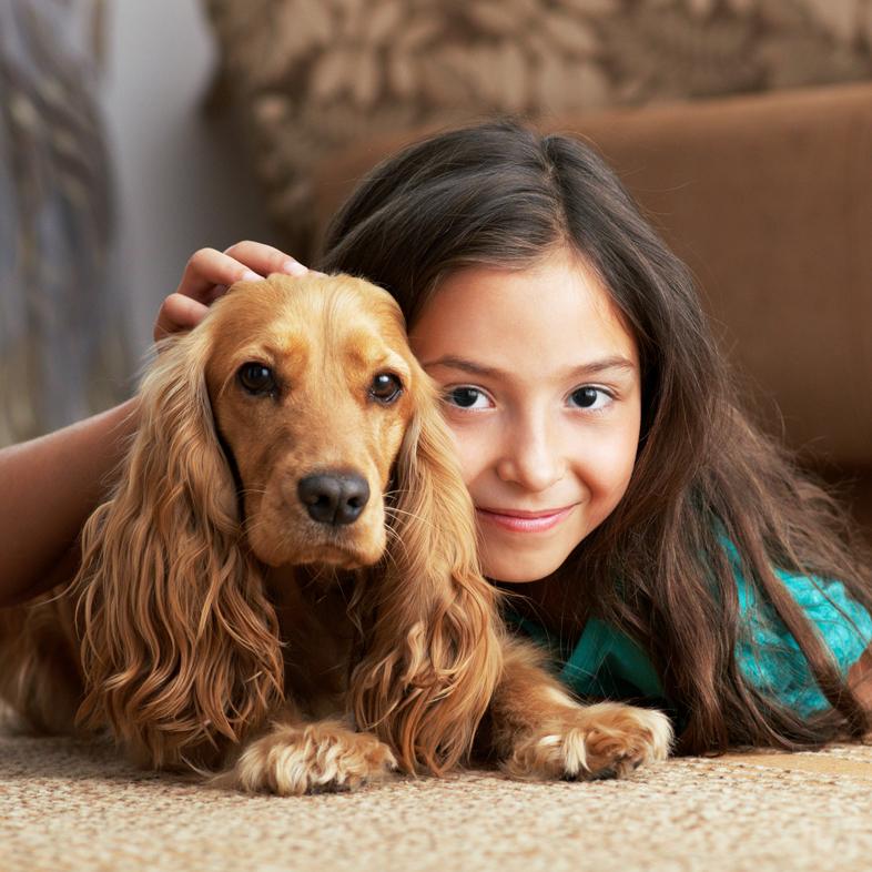 Girl laying on floor with dog
