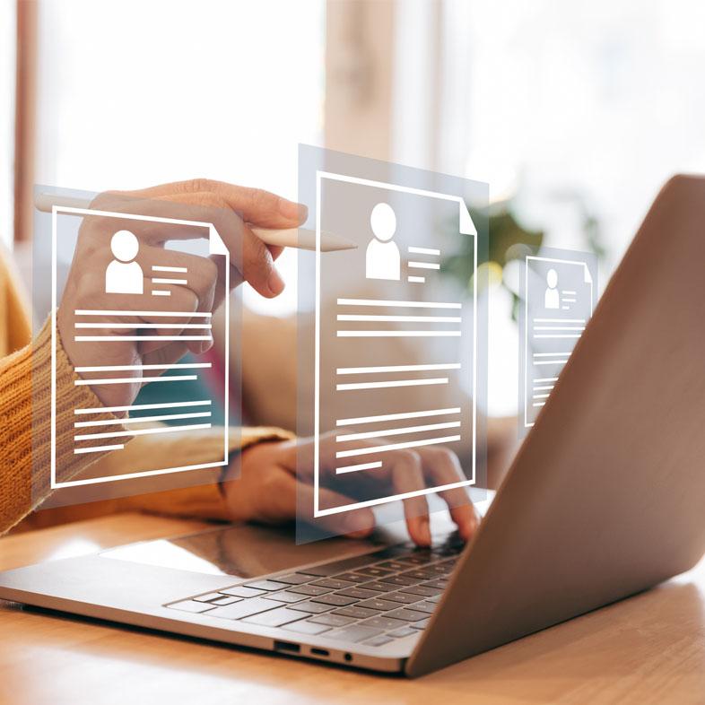 Person reviewing resumes on computer