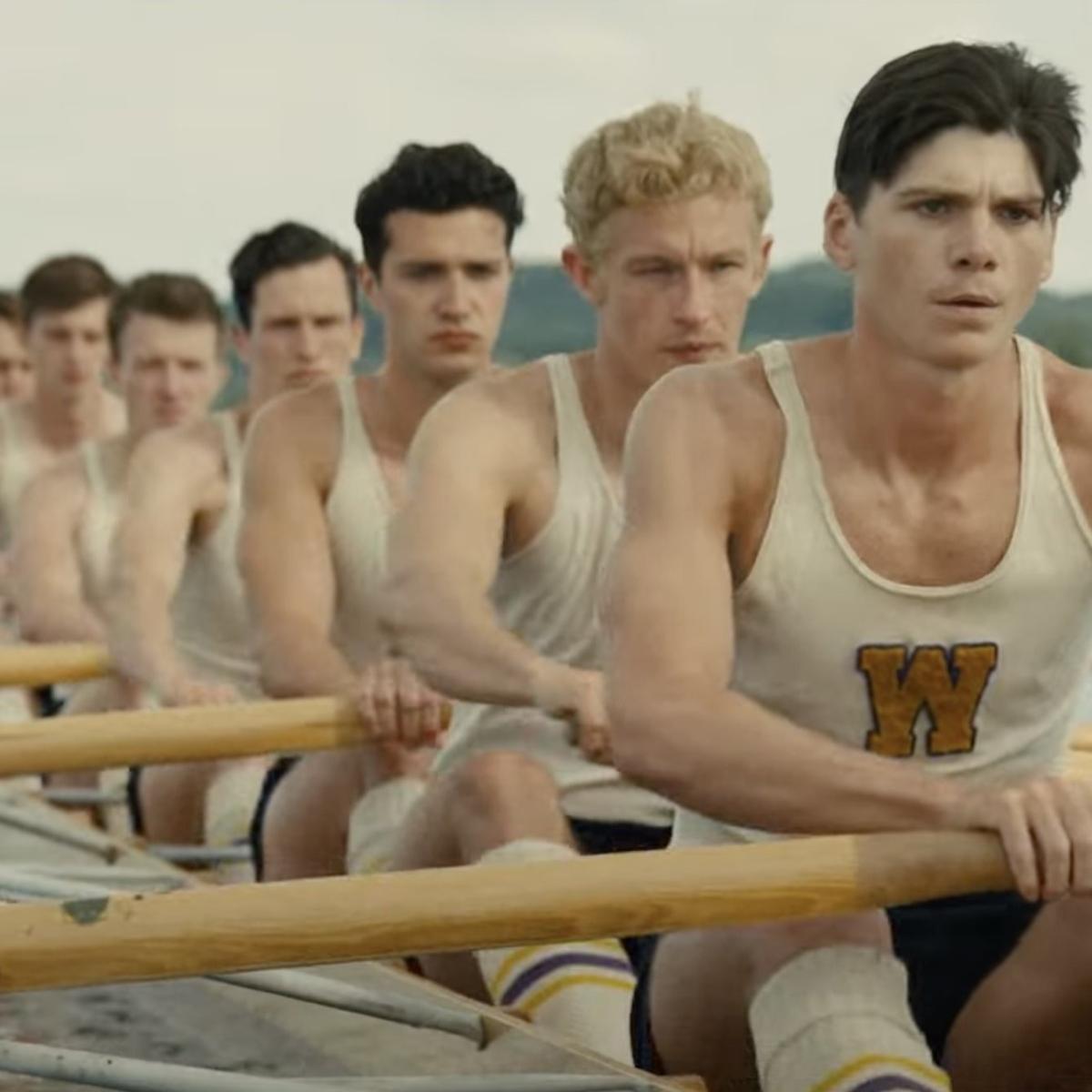 team of young men at oars in boat