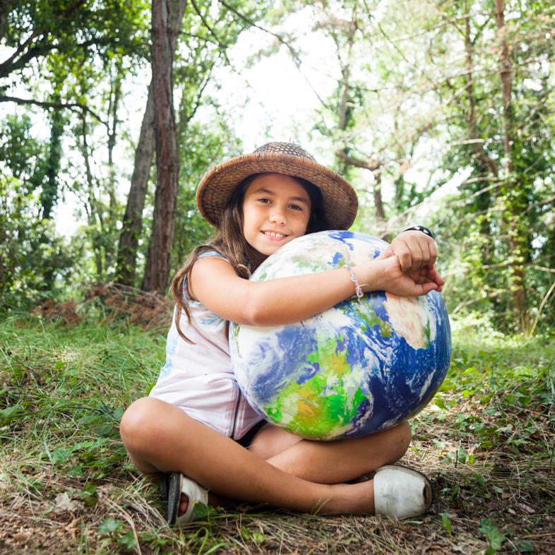 Girl hugging earth