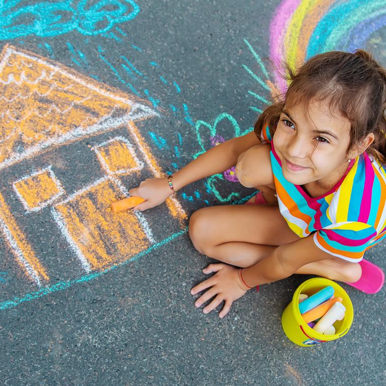 Girl drawing with chalk