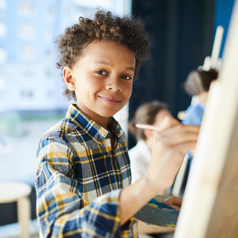 Young boy painting