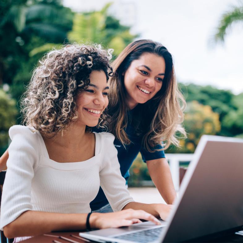 Mother and daughter working on computer