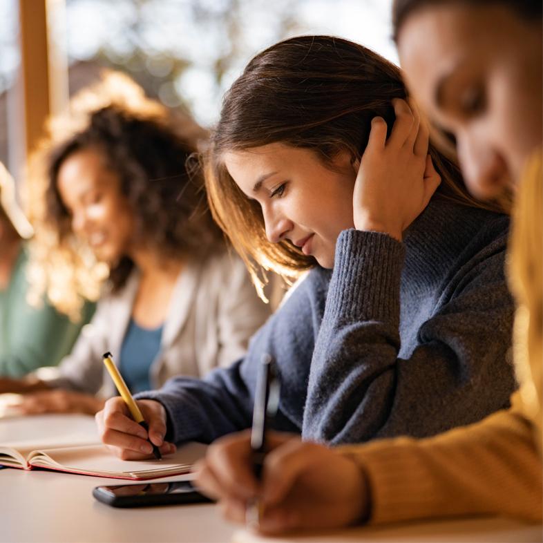 Teen girl writing in journal