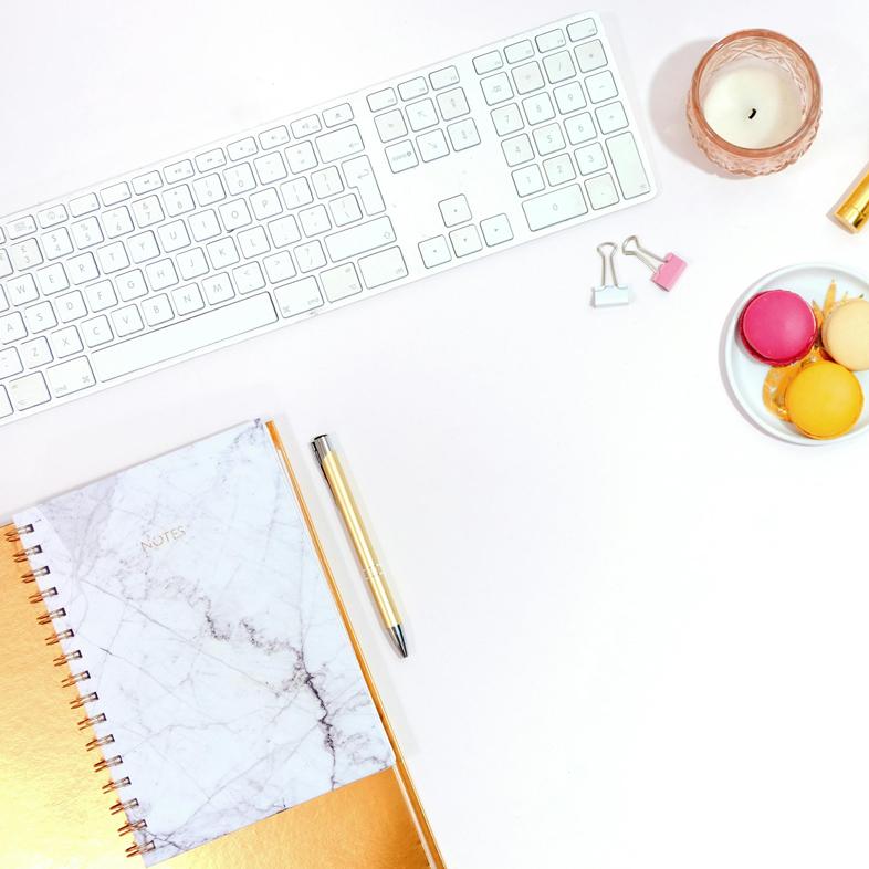 Desk with keyboard and notebooks
