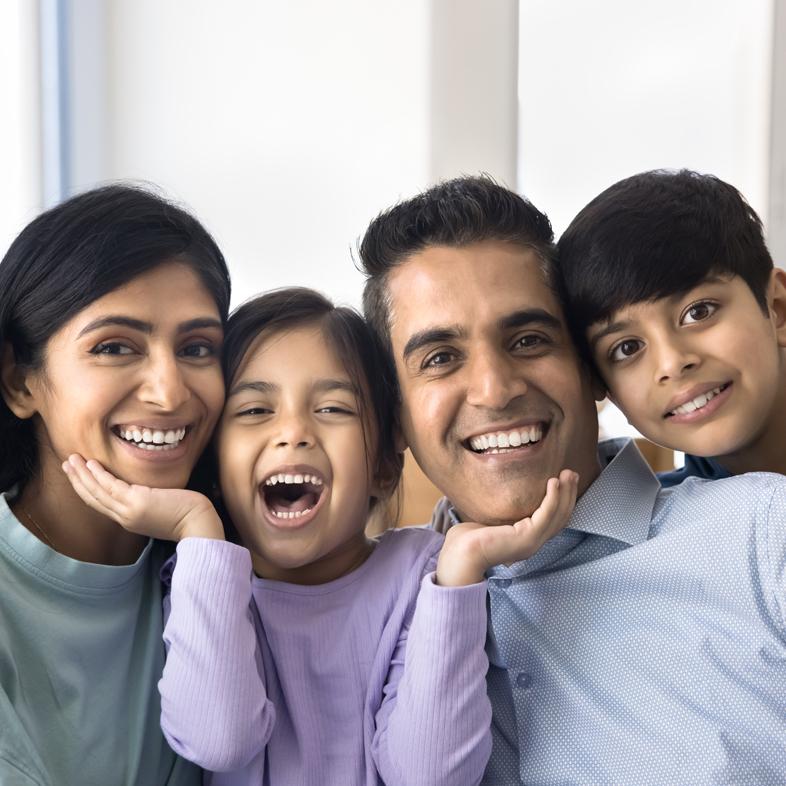 Family of four smiling
