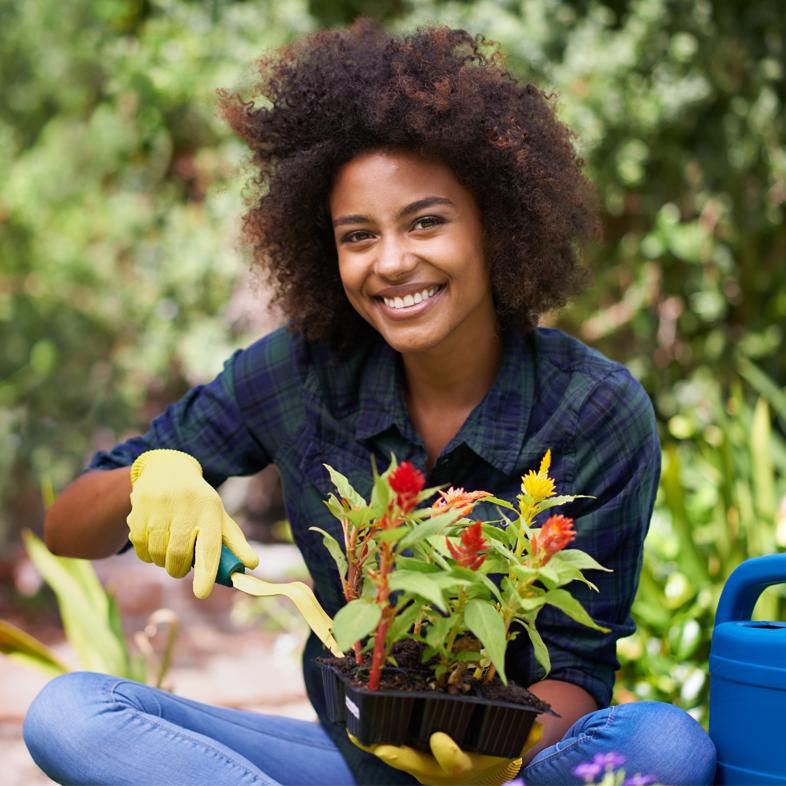 Woman outside holding flowers